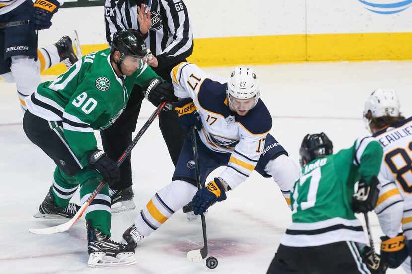 Dallas Stars center Jason Spezza (90) and Buffalo Sabres center Vladimir Sobotka (17) battle...