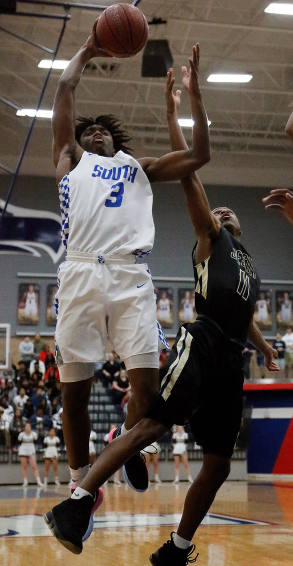 South Garland High School guard Tyrese Maxey (3) gets a shot up over Dallas Jesuit guard Max...