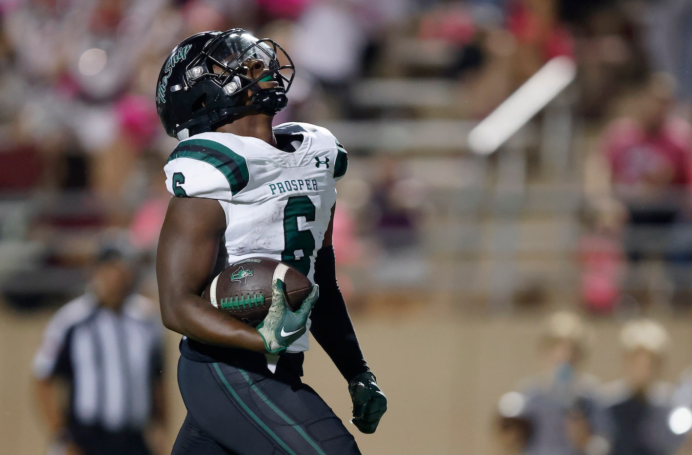 Prosper High running back Bryce Robinson (6) reacts as he crosses the goal line for a first...