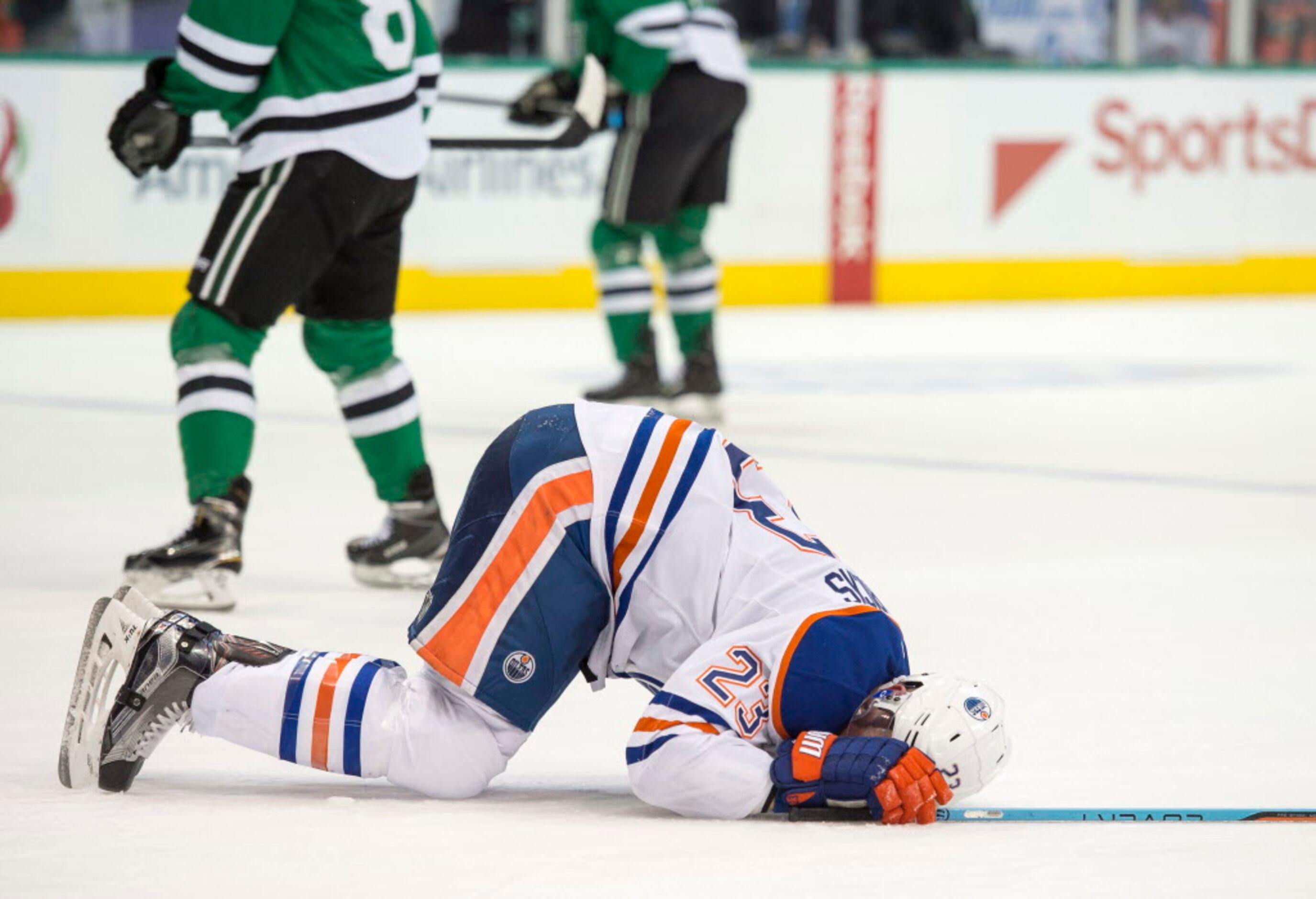 Oilers forward Matt Hendricks shows off shattered cup after taking