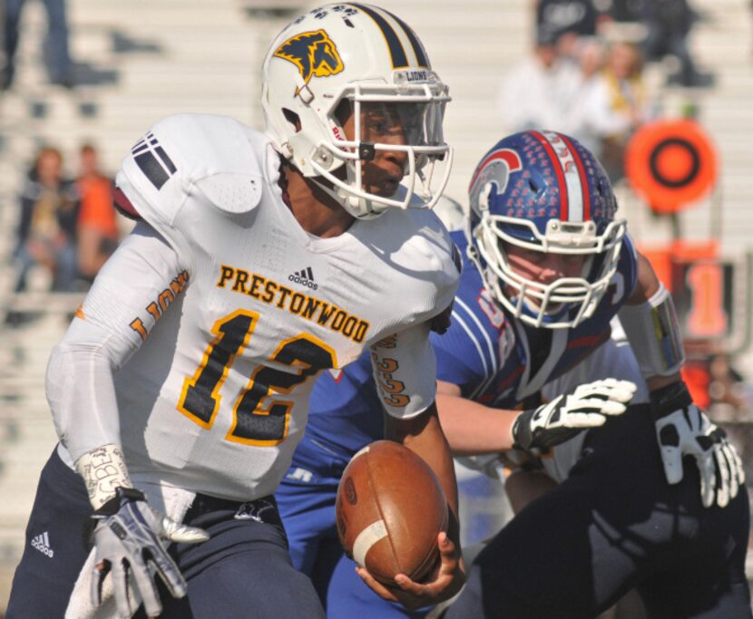 Prestonwood junior Twayne Blackwell (12) looks for an opening as TCA - Addison senior...