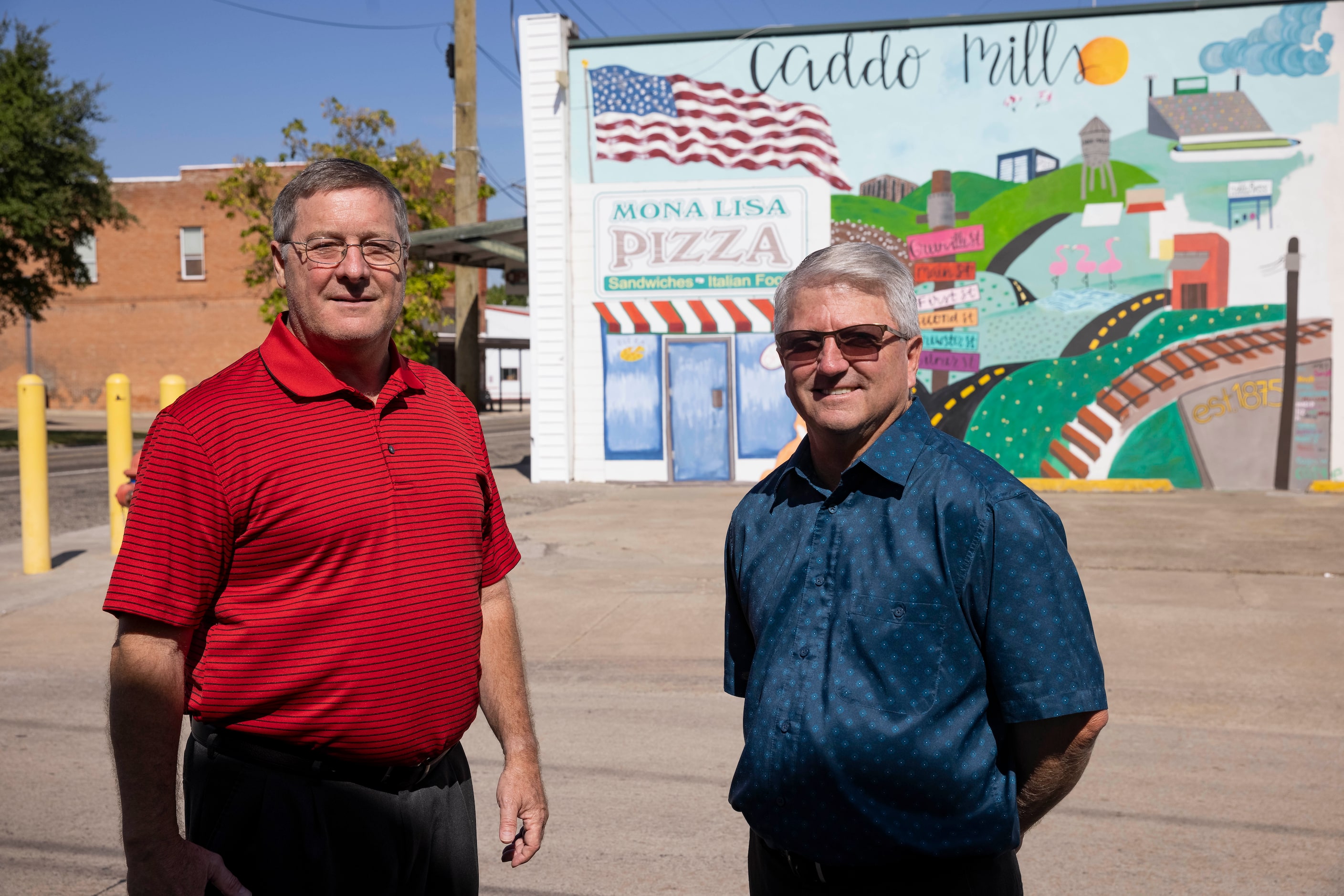 Joel Richardson (left), executive director for the Economic Development Board, and city...