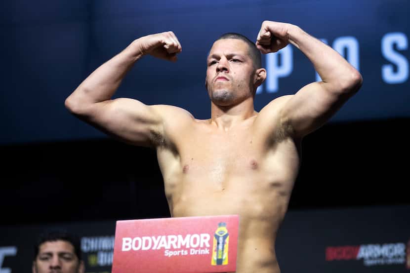 FILE - Welterweight fighter Nate Diaz poses on the scale during a ceremonial weigh-in for...