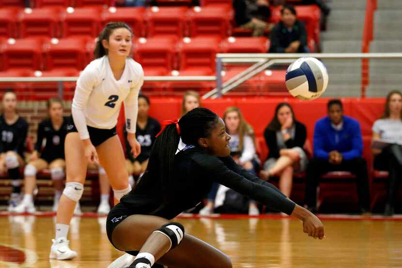 Hebron's Adanna Rollins digs a ball against Arlington Martin during the 6A Region I final at...
