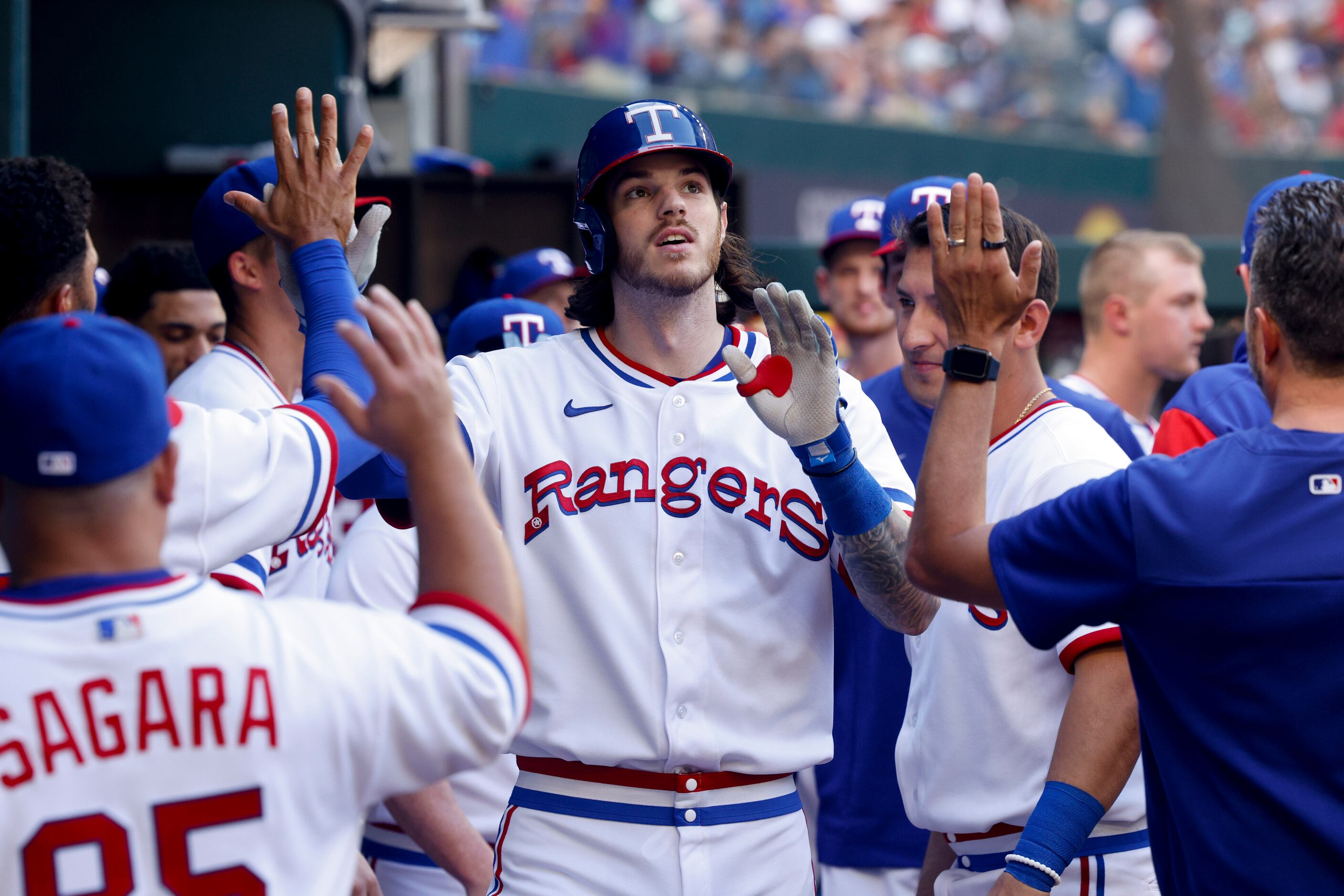 Texas Rangers catcher Jonah Heim (28) celebrates a home run with teammates during the fourth...