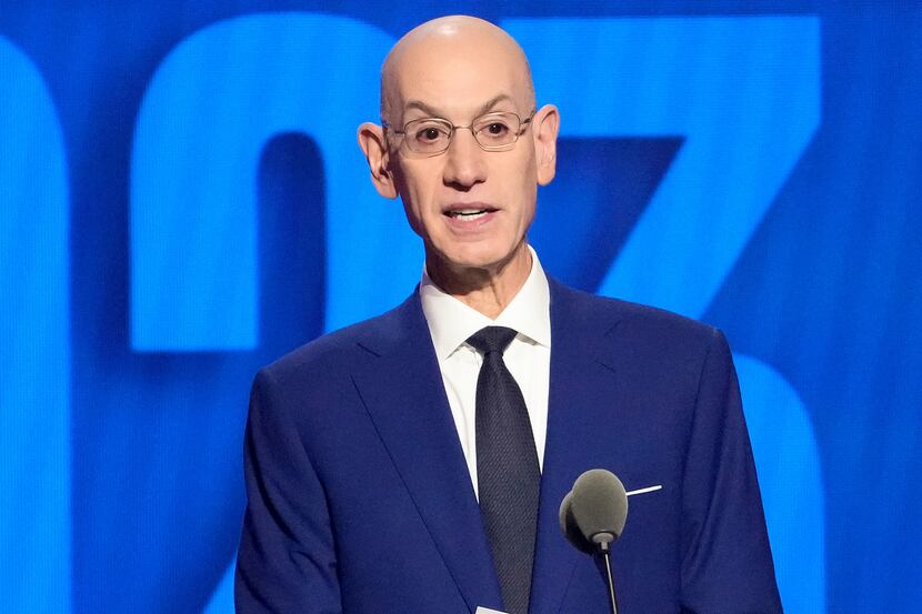 NBA Commissioner Adam Silver announces the 13th pick in the NBA basketball draft, Thursday,...