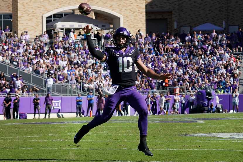TCU quarterback Josh Hoover finds open field to pass during the first half of an NCAA...