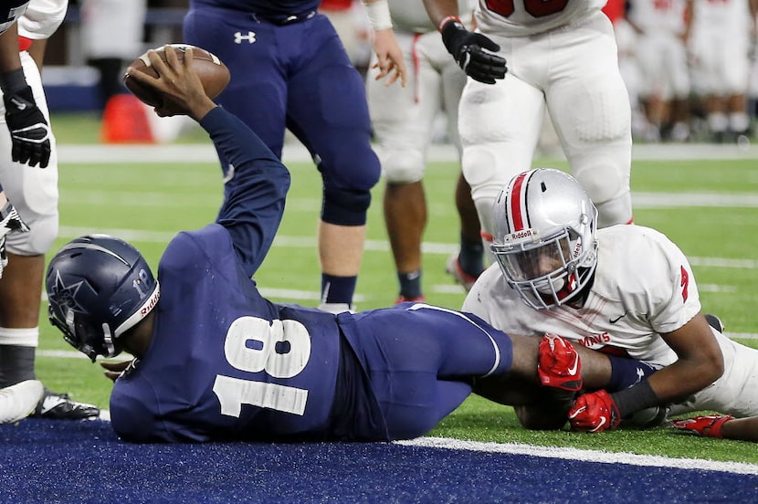 TXHSFB Frisco Lone Star quarterback Jason Shelley (18) celebrates scoring a touchdown as...