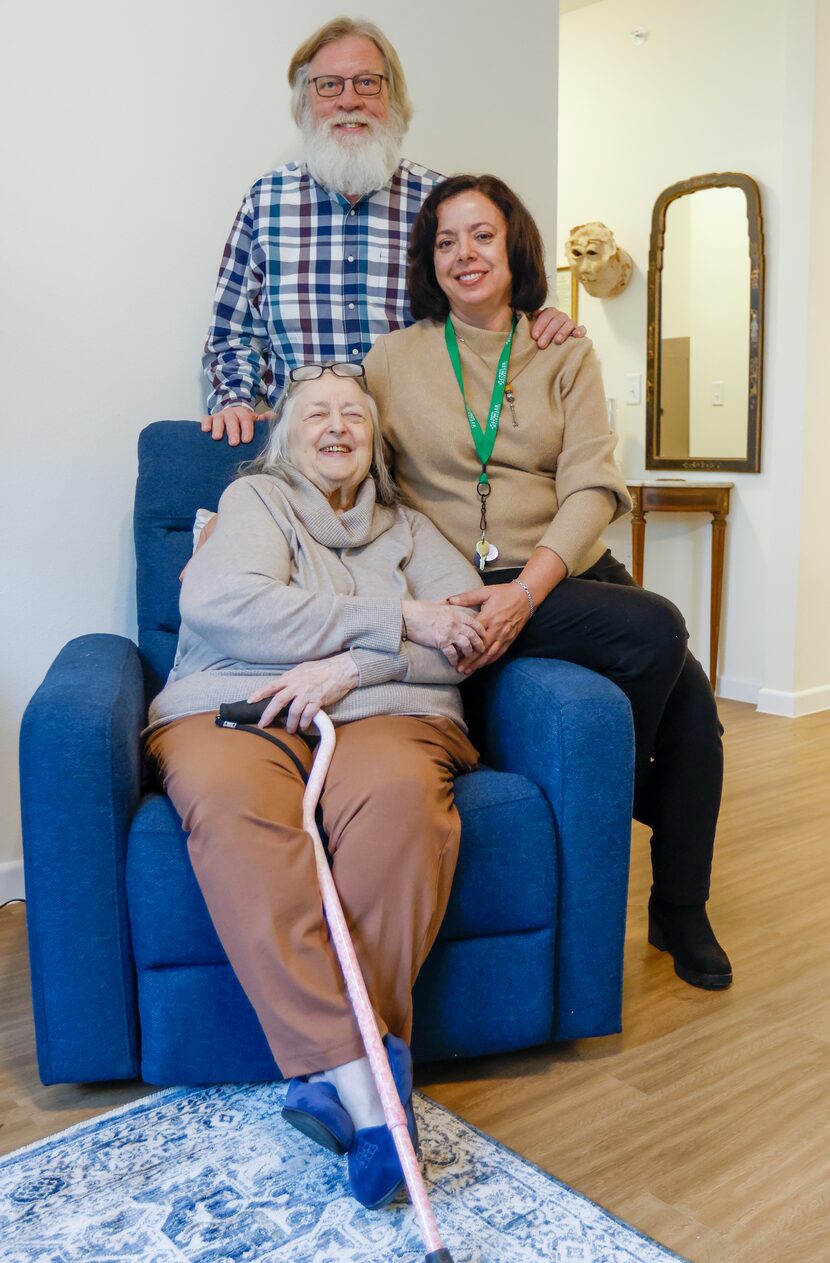 Poldi Tonin (front) sits by Chuck Stegman (back) and Maria Stanley at her new home at...