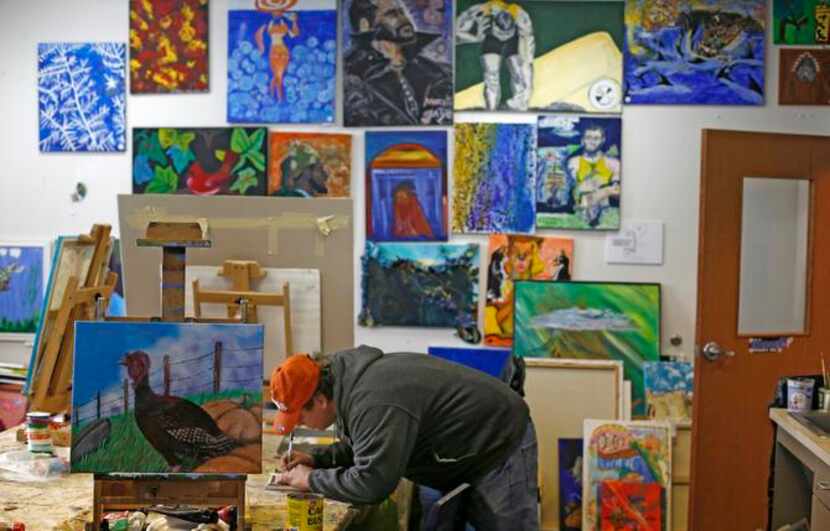 
Carlos Saenz works on an art project during the Open Art Program at The Stewpot homeless...