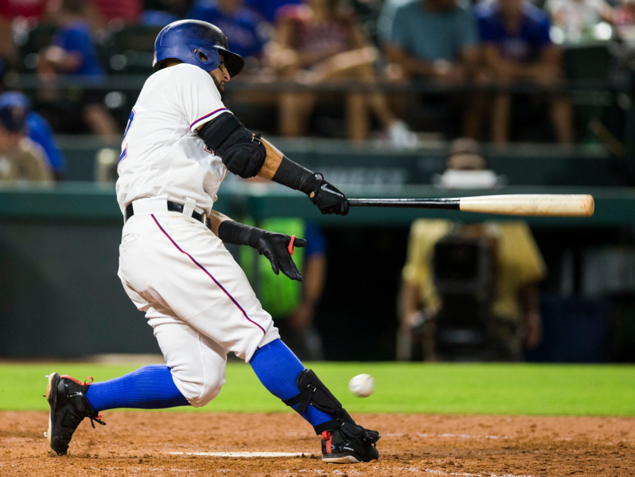 Texas Rangers second baseman Rougned Odor (12) fouls a ball off his right foot during the...