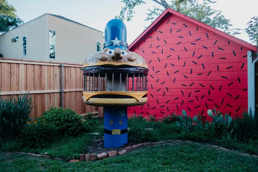 A piece of vintage McDonald's play equipment stands out in the backyard of The Slater.