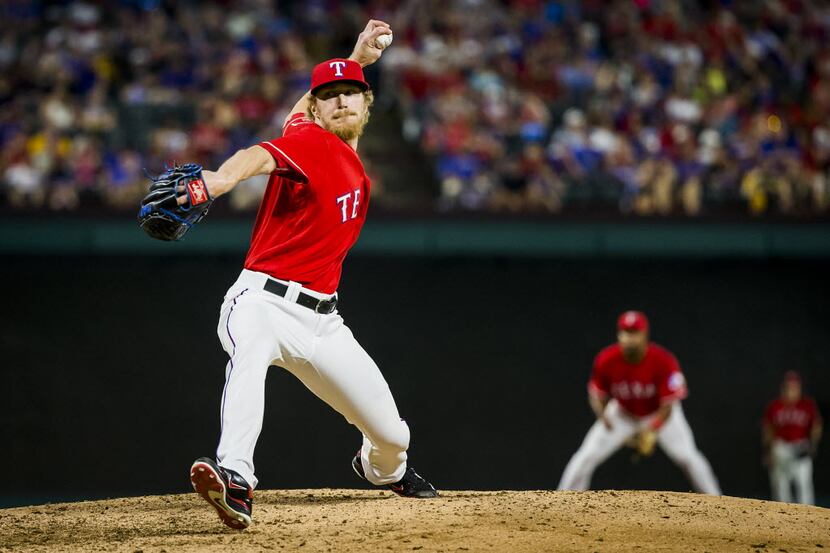 Texas Rangers relief pitcher Jake Diekman pitches during the seventh inning against the...
