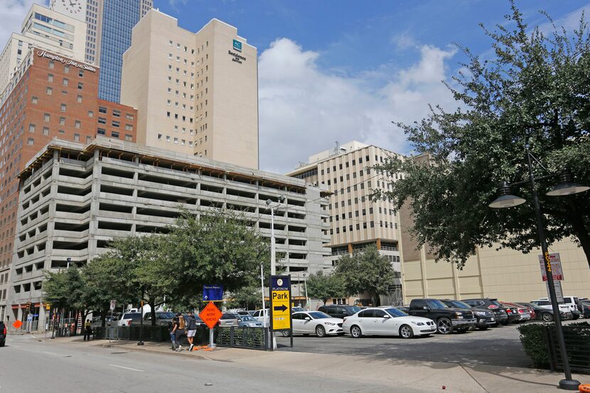 A parking lot where Club Reno once was at 316 S. Ervay is full of vehicles in downtown...