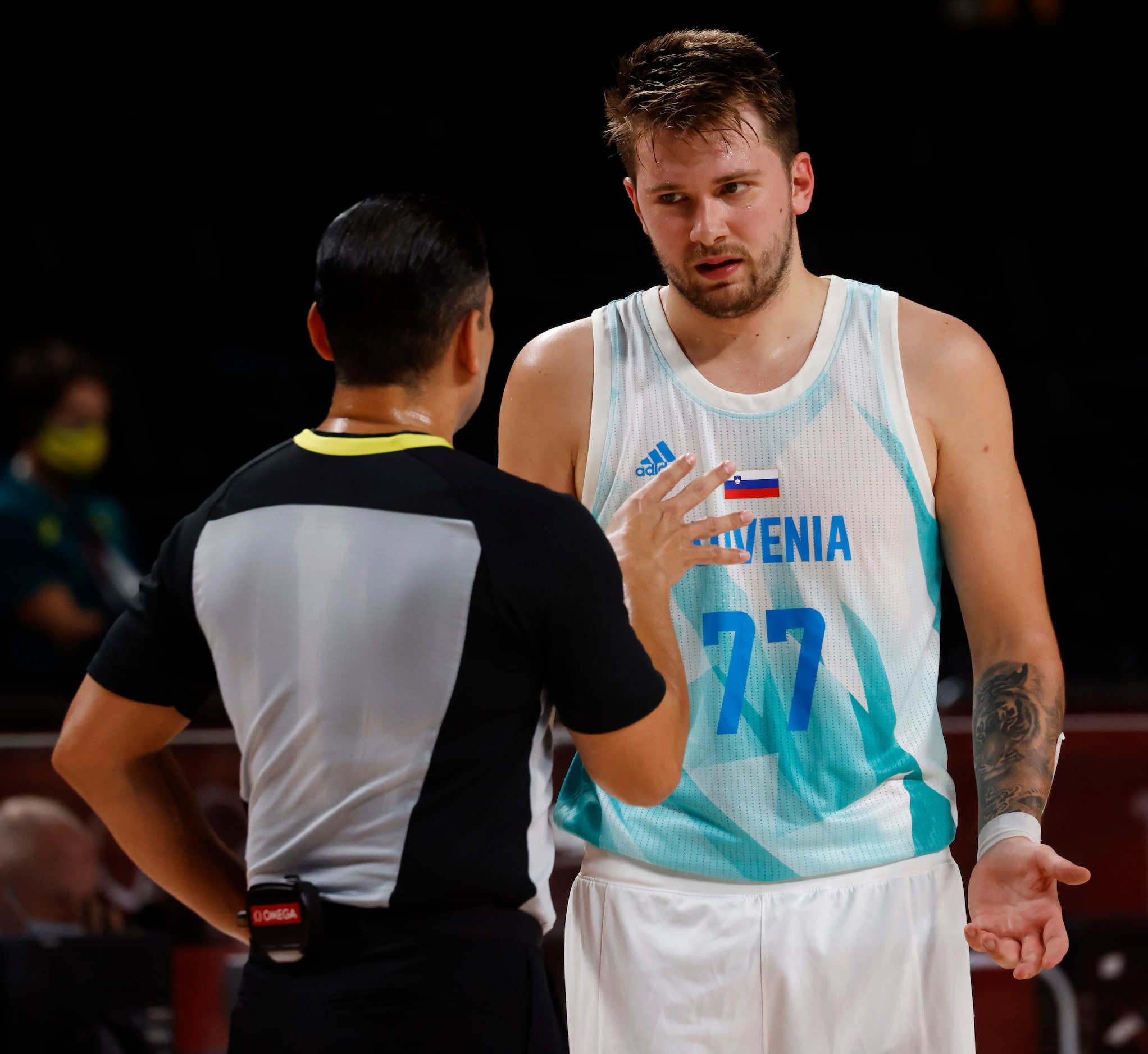 Slovenia’s Luka Doncic (77) questions an official after a play in a game against Australia...