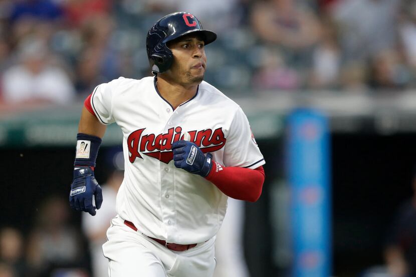 Cleveland Indians' Leonys Martin watches his ball after hitting a solo home run off Los...