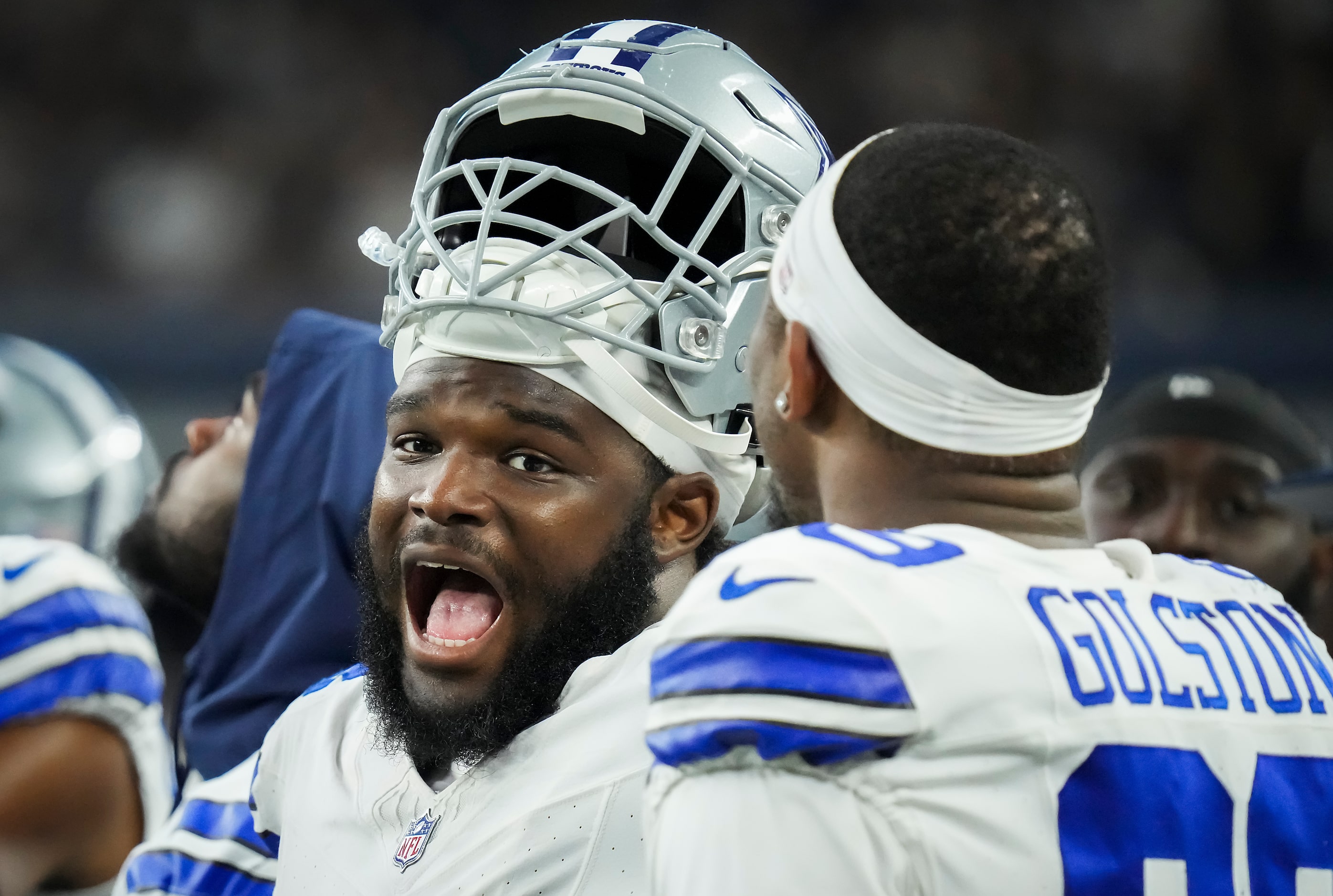 Dallas Cowboys defensive tackle Mazi Smith (58) talks with defensive end Chauncey Golston...