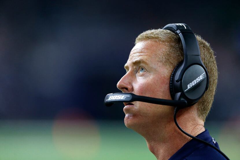 Dallas Cowboys head coach Jason Garrett looks up at the video board during the second half...