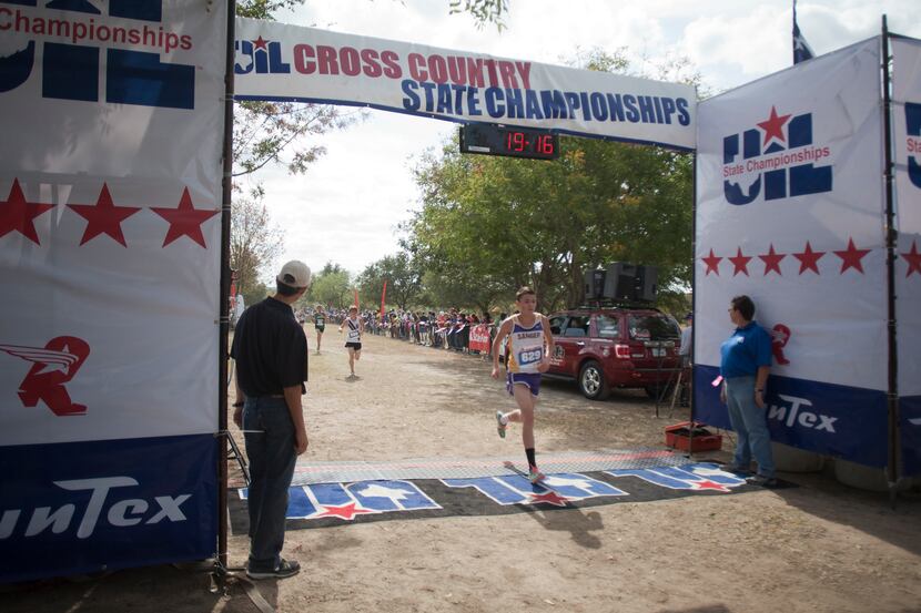 Sanger's Chase Alvey crosses the finish line during the 2012 UIL 3A cross country state...