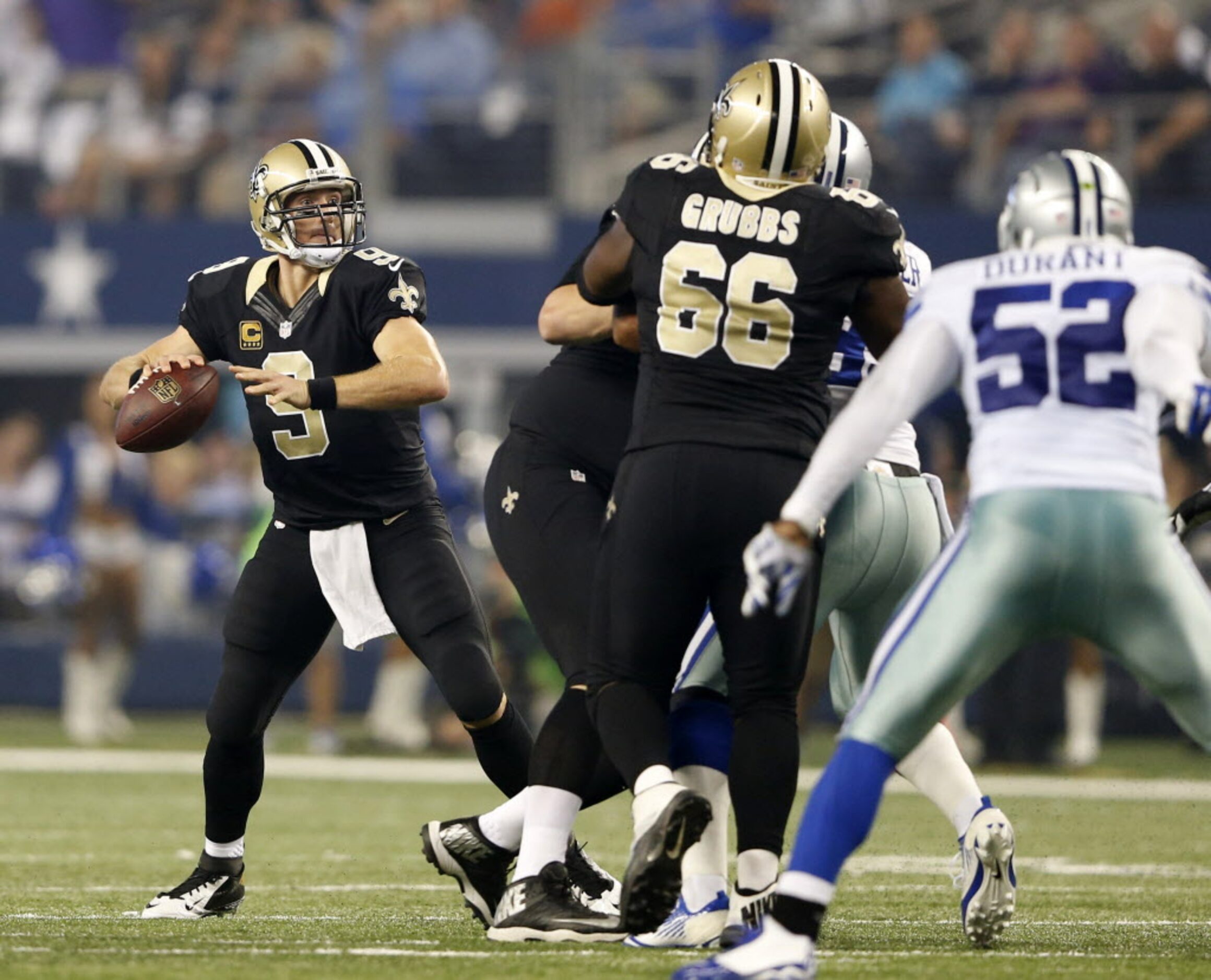 New Orleans Saints quarterback Drew Brees (9) looks to pass in a game against the New...