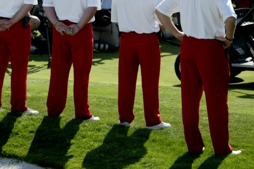 Tournament volunteers clad in the signature red slacks identifying them as Salesmanship Club...