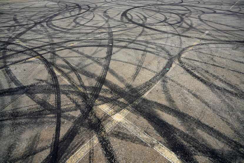 Skid marks are seen in a parking lot at 1400 S. Henderson Avenue on Monday, March 9, 2020,...