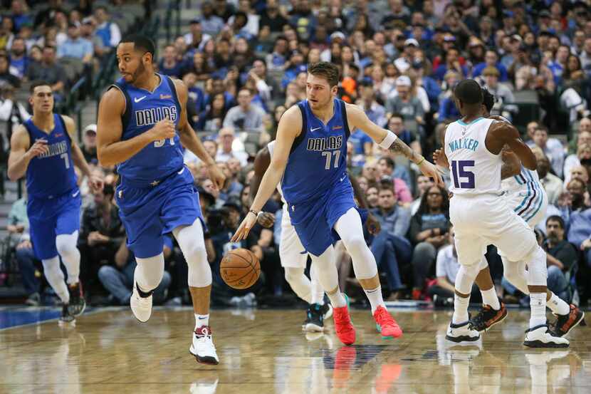 Dallas Mavericks forward Luka Doncic (77) brings the ball downcourt during the first half a...