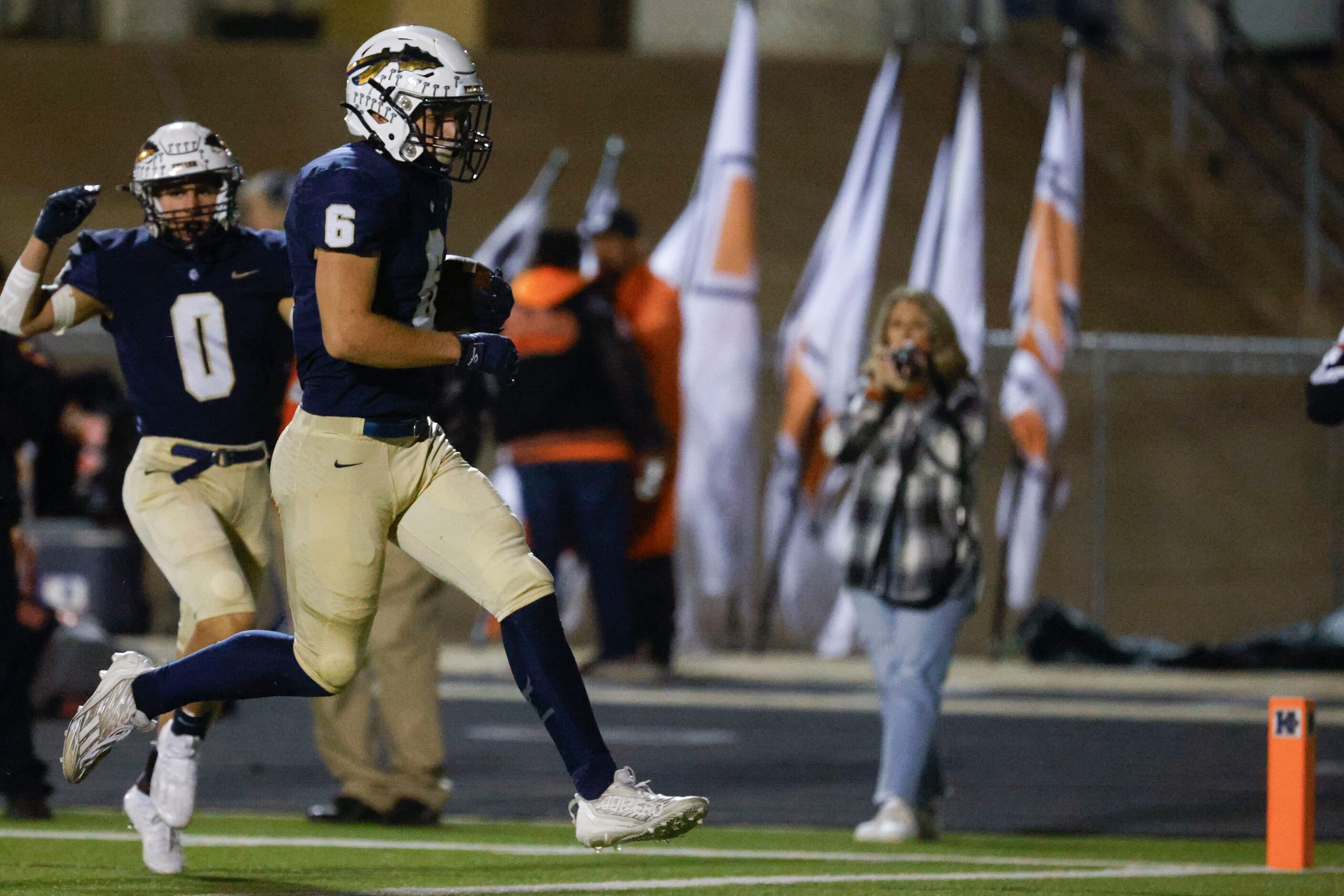 Keller High school’s Drew Roberts (6) runs to score a touchdown against Haltom High school...