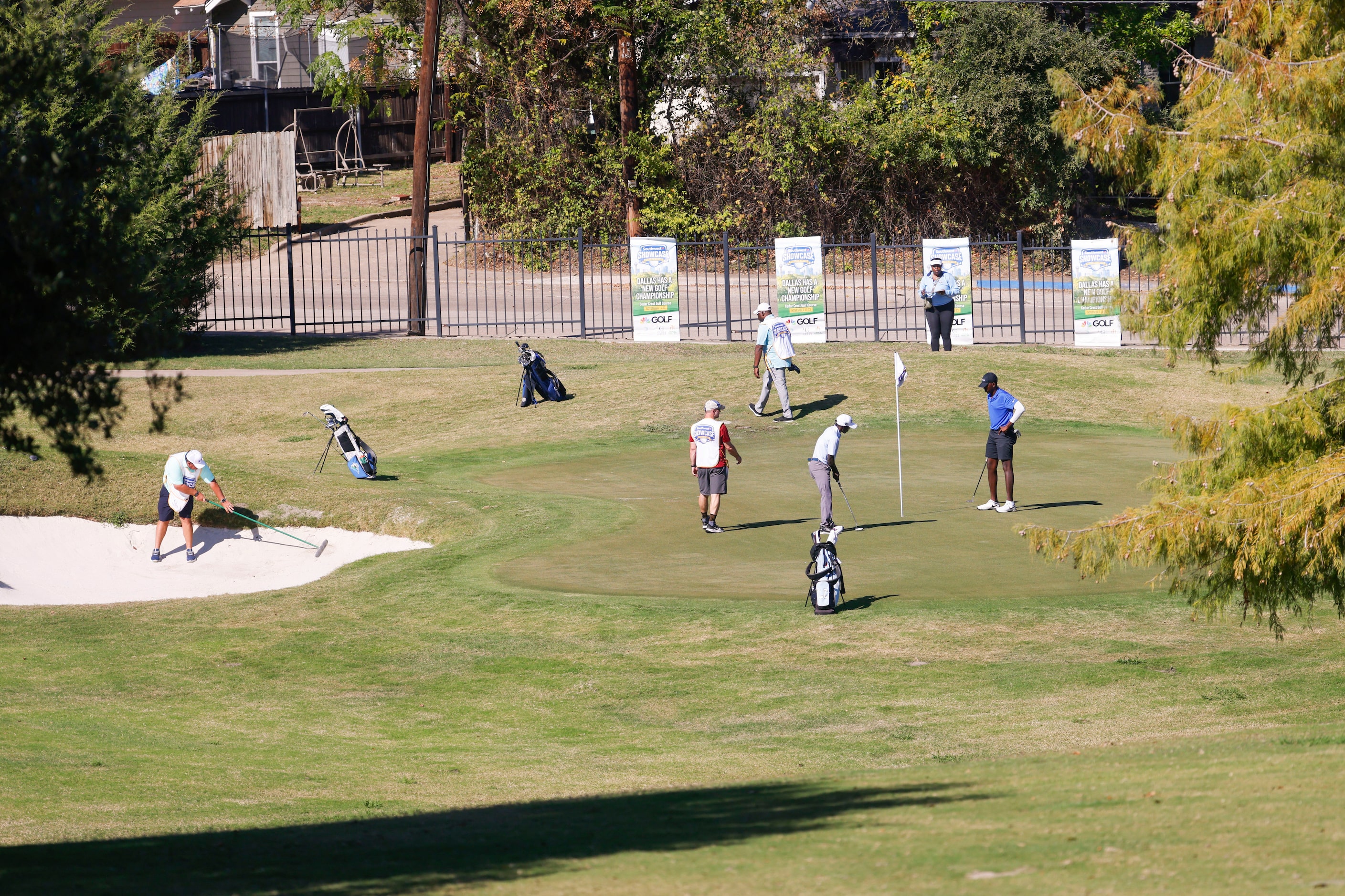 Golfers play on the seventh green during the Southwest Airlines Showcase amateur golf...