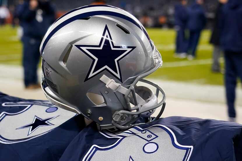 A Dallas Cowboys helmet on the bench before an NFL football game against the Chicago Bears...