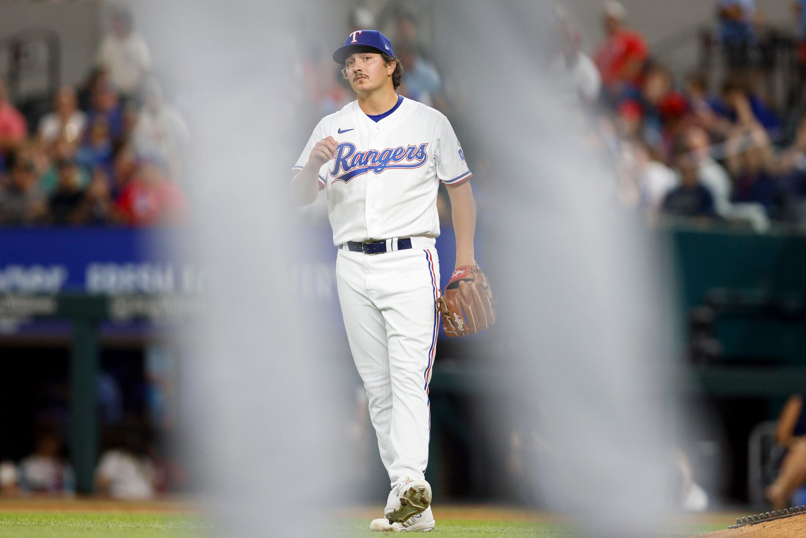 Texas Rangers relief pitcher Owen White (43) reacts after his first career strikeout during...