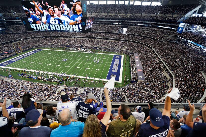 FILE — Dallas Cowboys fans cheer tight end Blake Jarwin's first quarter touchdown against...