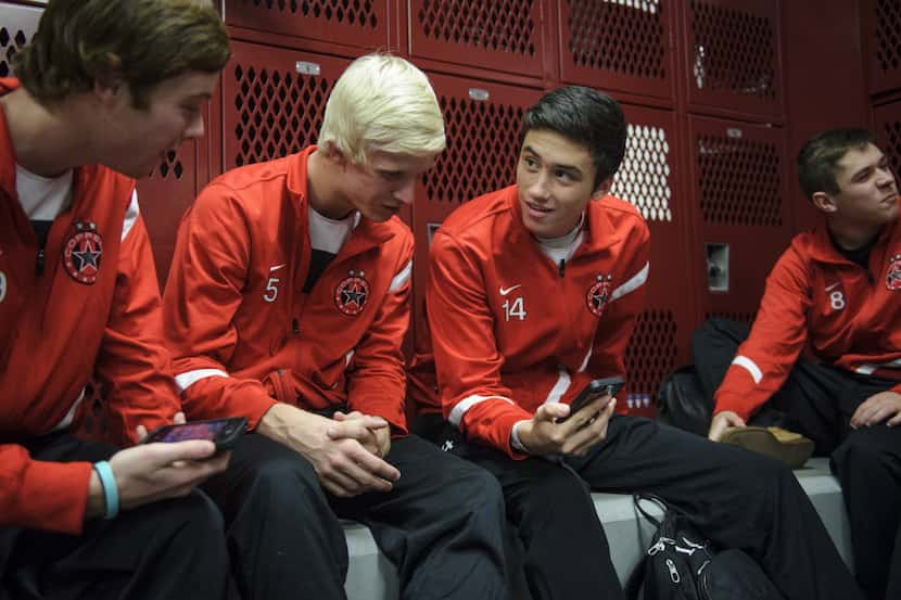 Kellen Reid (second right), a senior at Coppell High School and a captain of the soccer...
