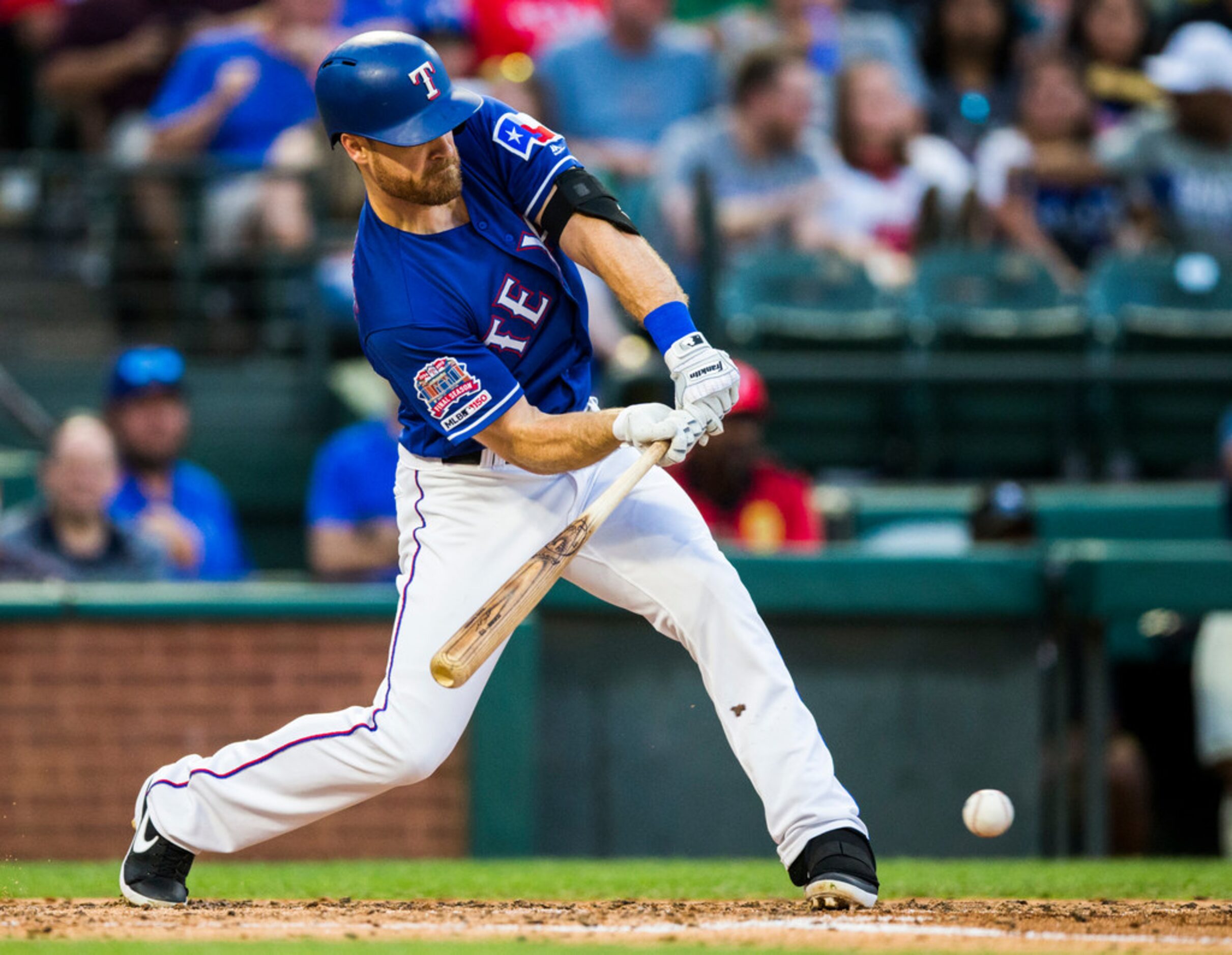 Texas Rangers short stop Logan Forsythe (41) hits a grounder during the third inning of an...