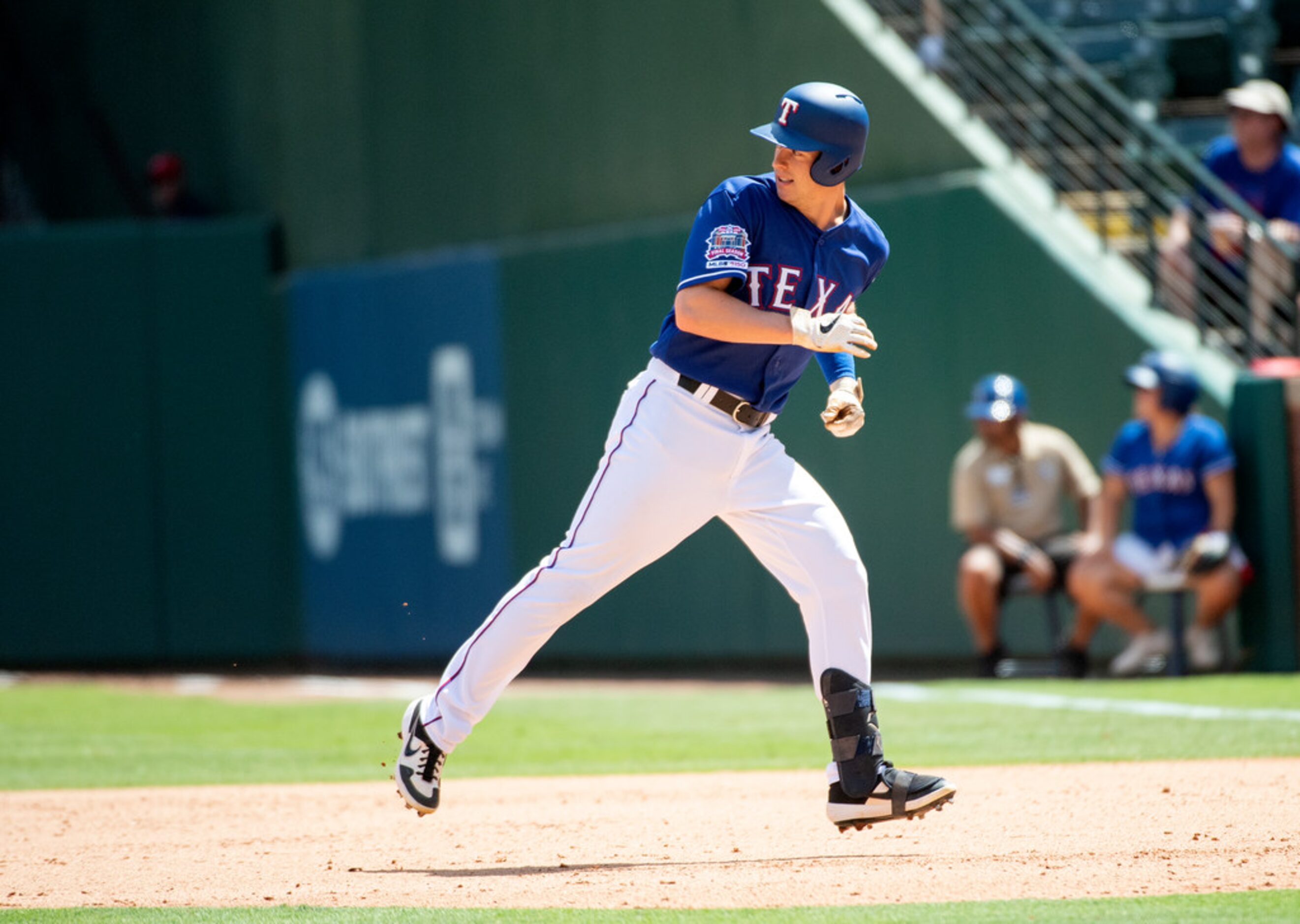 Texas Rangers' Nick Solak rounds first base on a single off of Los Angeles Angels starting...