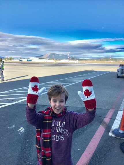 Doug Wilson, 9, wearing gloves with the Canadian flag.