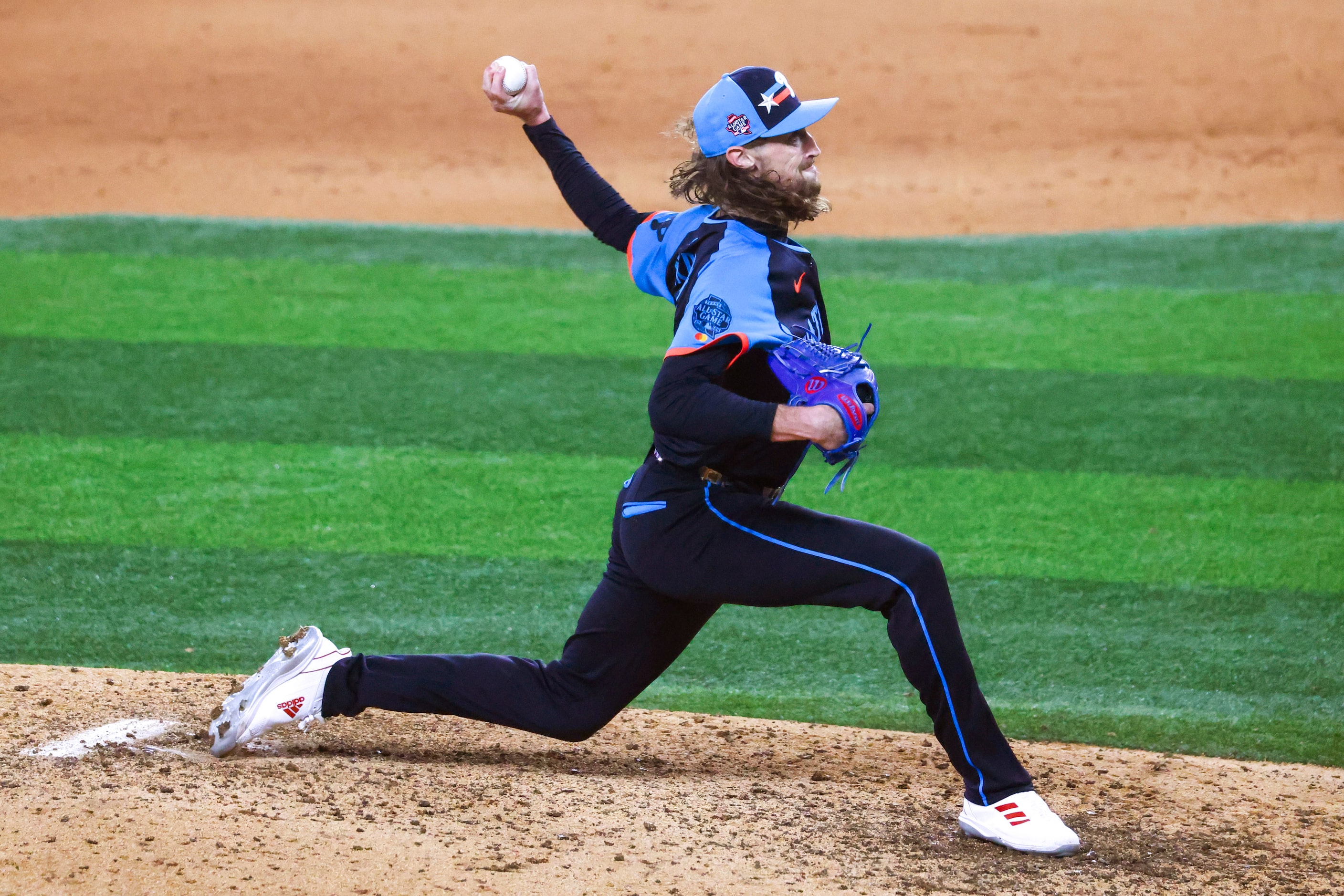 National League's Matt Strahm, of the Philadelphia Phillies, throws during the seventh...