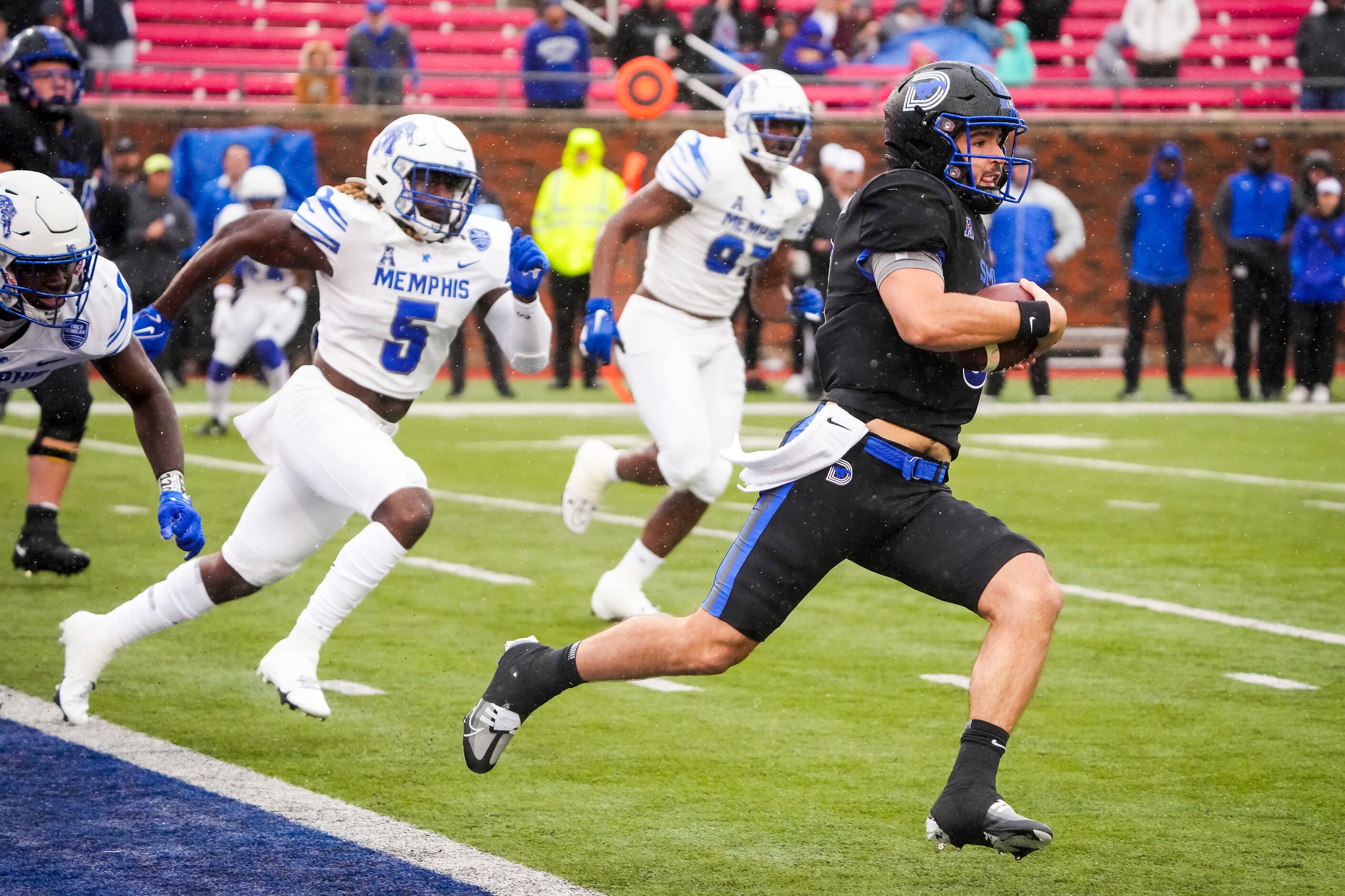 SMU quarterback Tanner Mordecai (8) scrambles from his own end zone to avoid Memphis...