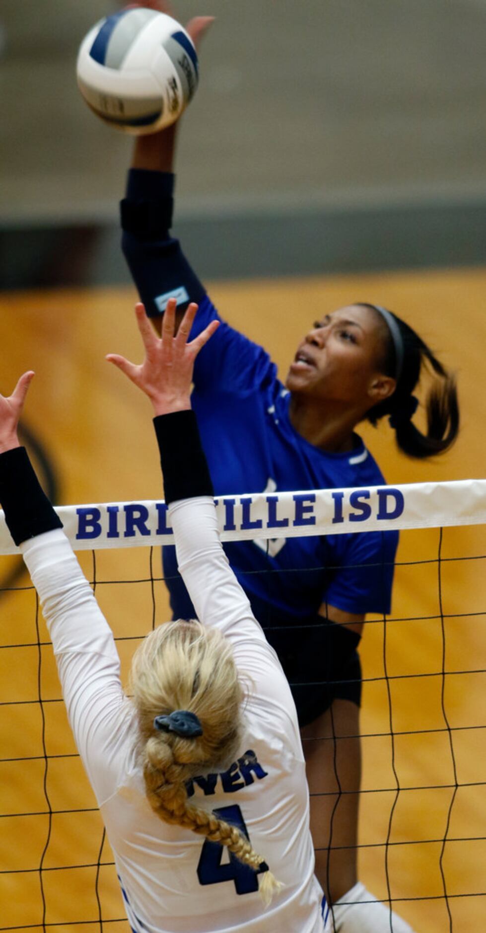 Trophy Club Byron Nelson outside hitter Charitie Luper (10) powers a shot past the defense...