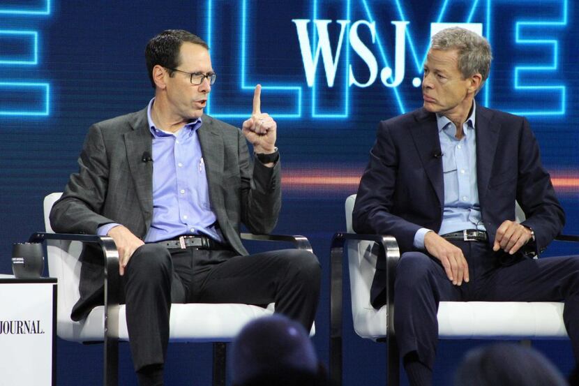 AT&T chief executive Randall Stephenson (left) and Time Warner chief executive Jeffrey...