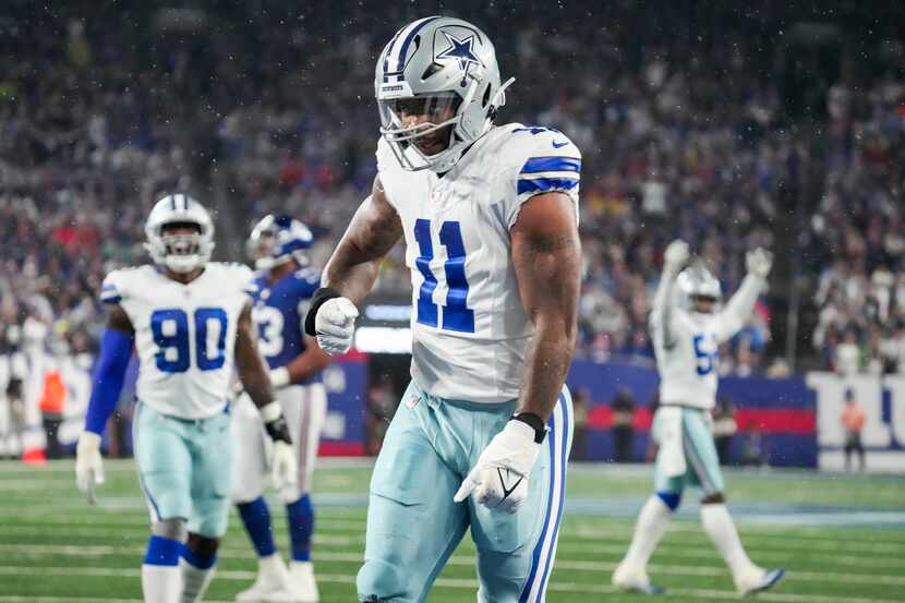 Dallas Cowboys linebacker Micah Parsons (11) celebrates after a sack of New York Giants...