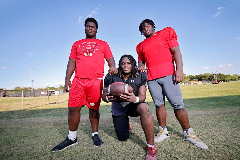 Cedar Hill High School football players, triplets Jordan (from left) Isaiah and Devin...