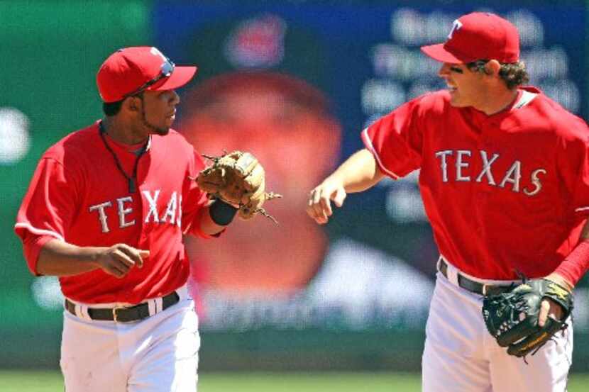 ORG XMIT: *S1967D17D* Texas' shortstop Elvis Andrus (left) and Ian Kinsler (right) celebrate...