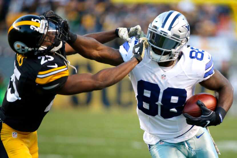 Dallas Cowboys wide receiver Dez Bryant (88) grabs the face mask of Pittsburgh Steelers...