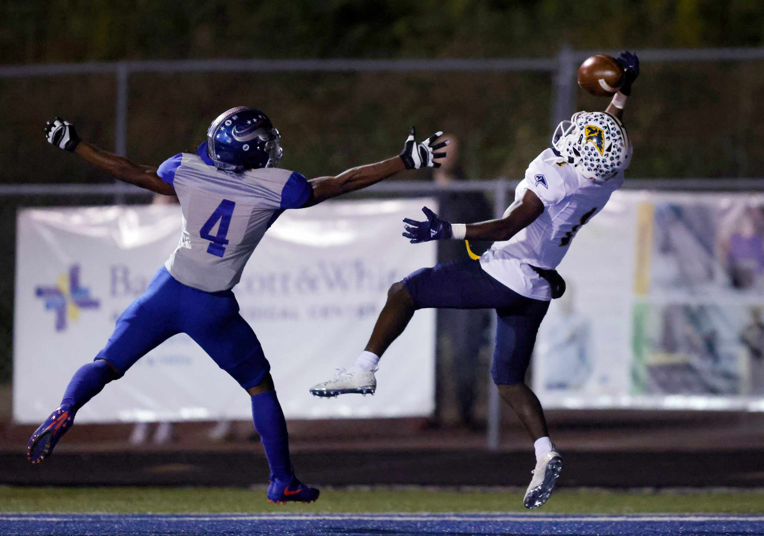 Plano Prestonwood Christian Academy receiver Nate Stafford (1) attempts the one-handed catch...