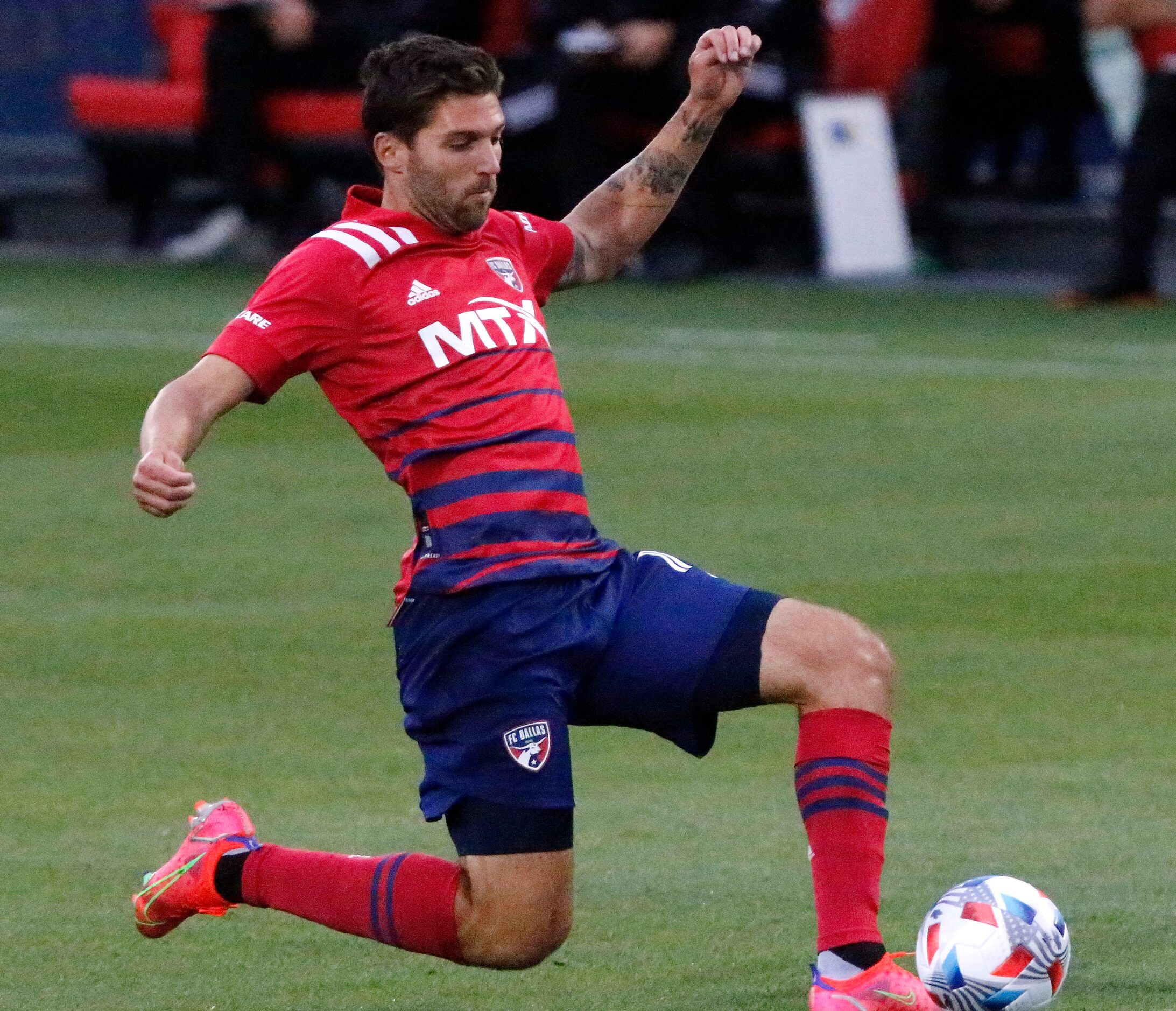 FC Dallas midfielder Ryan Hollingshead (12) reaches the soccer ball during the first half as...