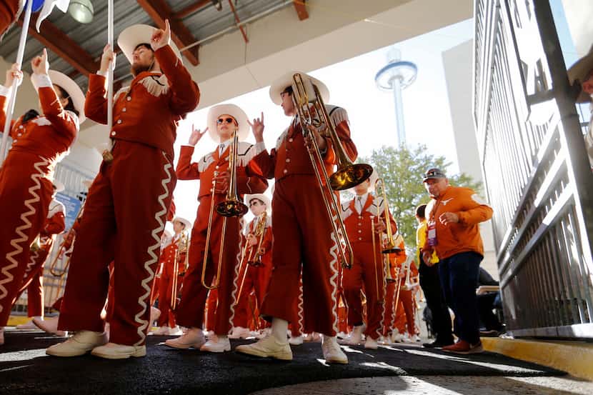 Texas Longhorns marching band enters the stadium before a game against Oklahoma Sooners in...