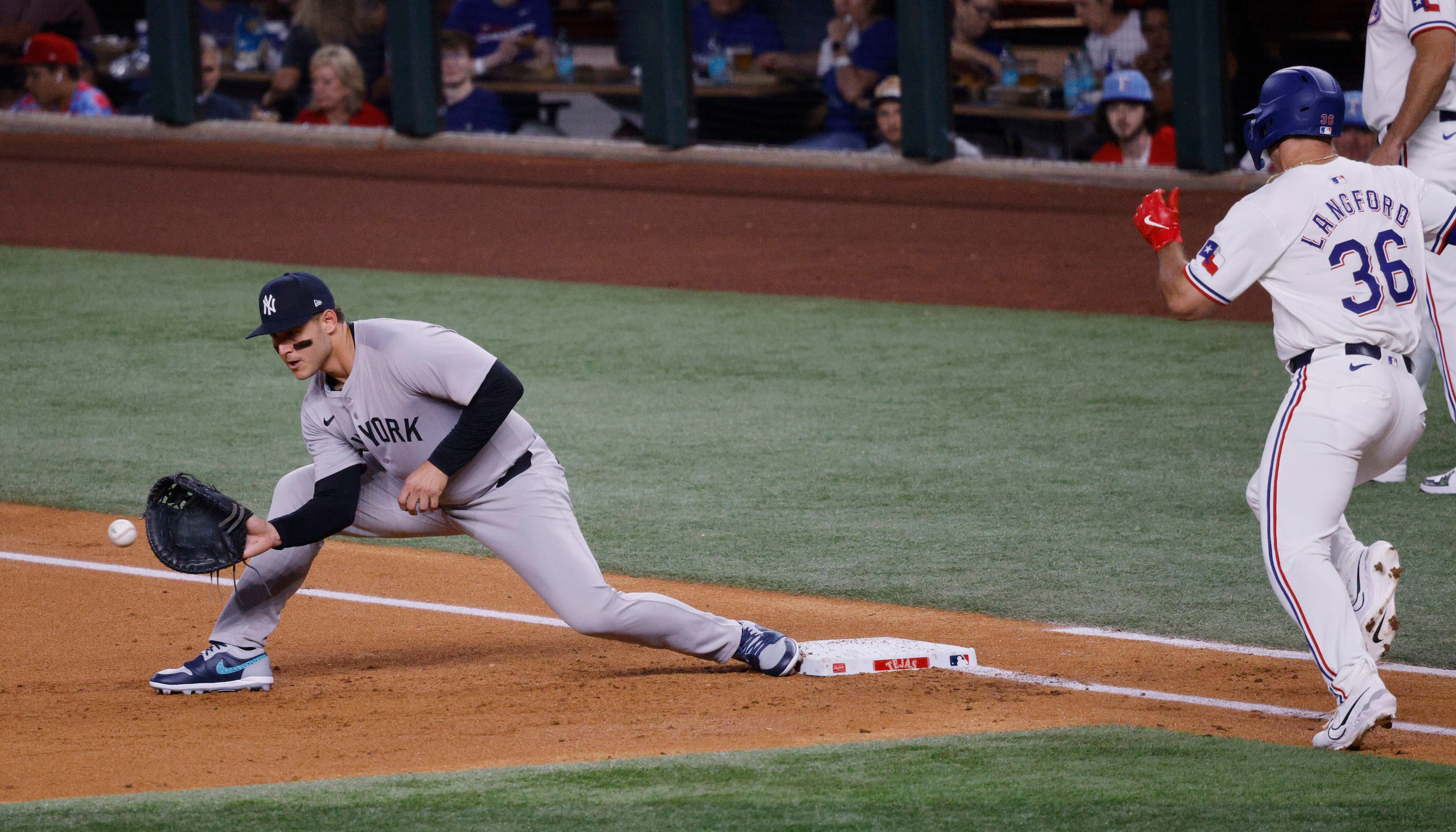 New York Yankees first base Anthony Rizzo (48) receives a ball before Texas Rangers...