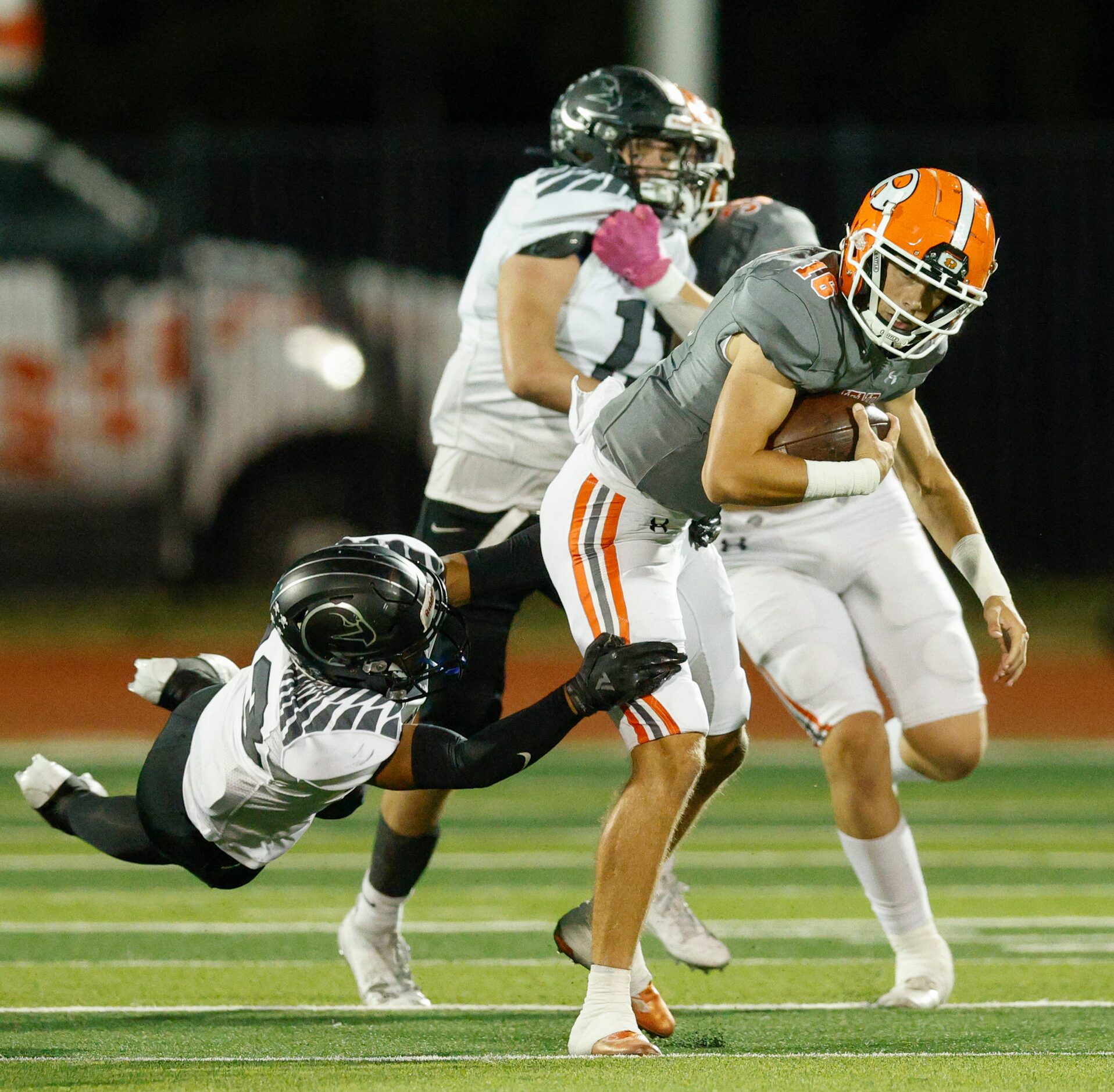 North Forney’s Jaylen Grey (13) tackles Rockwall quarterback Mason Marshall (16) during the...