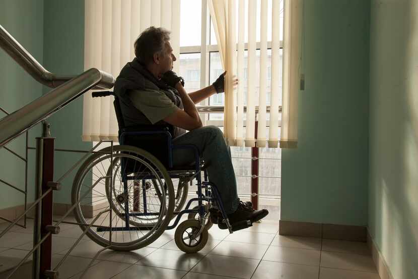 senior man on wheelchair in hospital,